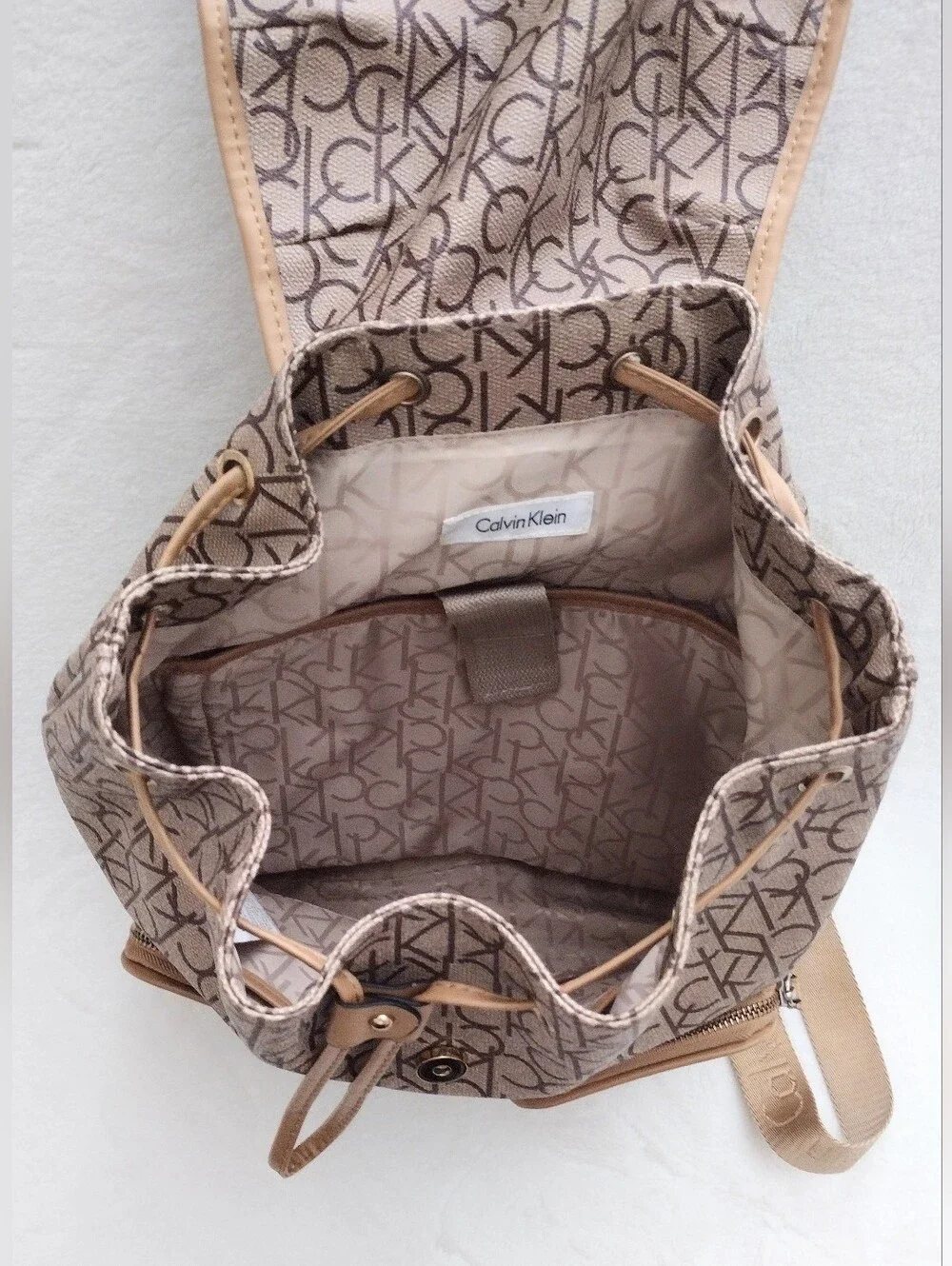 Calvin Klein Monogram Drawstring Backpack in Beige and Brown